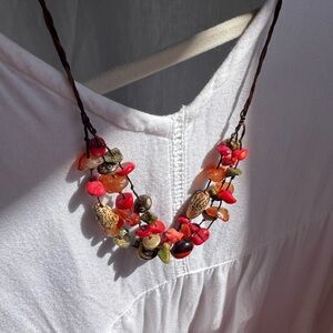 Coral, gems and seeds red necklace